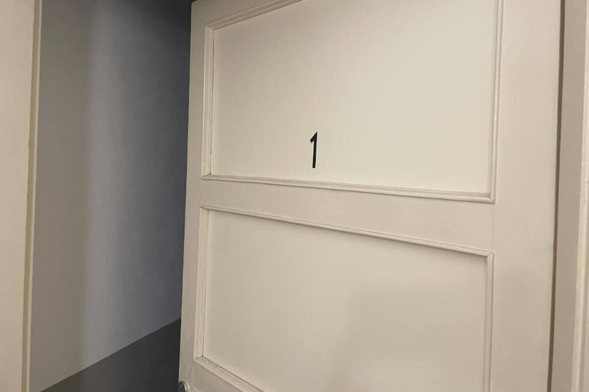 A door with the number 1 on it, indicating a room number.