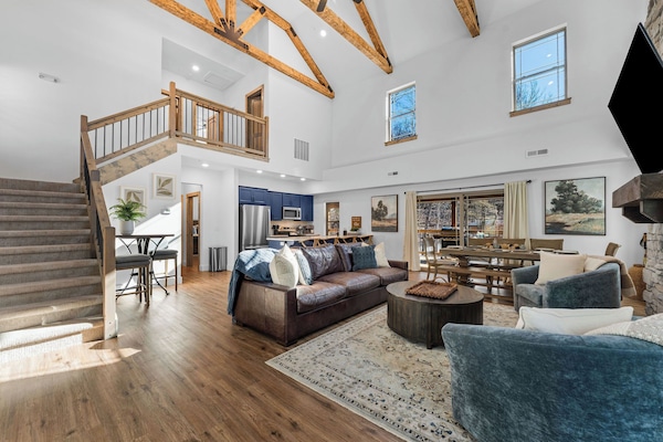 Walk in to the open-concept living space with vaulted ceilings, awesome wood beams and plenty of room to gather and relax.