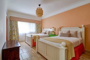 A bedroom with two beds, a wooden dresser, a green nightstand, and a hanging light fixture. - ®3BR{Beach~Retreat}@Terrenas +Pool+Maid+Beachfront (Las Terrenas)