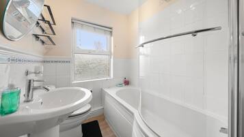 Separate tub and shower, deep soaking tub, hair dryer, towels