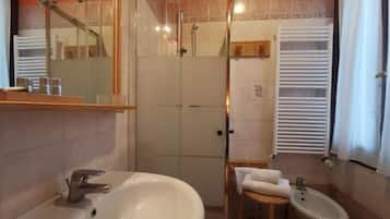 Combined shower/tub, hair dryer, towels, soap