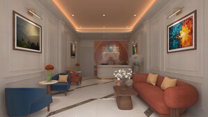 A modern hotel lobby with a reception desk, seating areas, and artwork on the walls. - Binh Minh Sapa Hotel (Sa Pa)