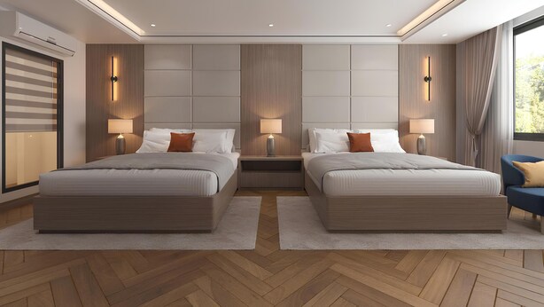 A modern hotel room with two beds, a large window, and a herringbone wood floor. - Binh Minh Sapa Hotel (Sa Pa)