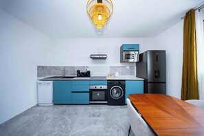 Deluxe Apartment, 2 Bedrooms, Non Smoking | Private kitchen | High chair - Guyane Appart'Hôtel (Cayenne)