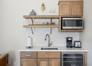 Fridge, microwave, coffee/tea maker, toaster