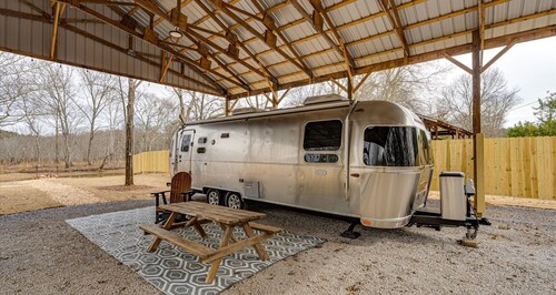 Johnny's Lake Escape lakeside covered Airstream: firepit, outdoor seats; kayaks