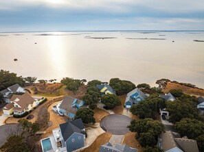 A residential area with houses and a large body of water. - Soundfront Corolla Home with Hot Tub & Sunset Views! (Corolla)