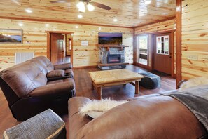 TV, fireplace - Spacious 8-bedroom Cabin in the Smokies w/ Heated Pool, Hot Tub, & Movie/Game Rm (Sevierville)