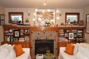 Smart TV, fireplace, books, printers