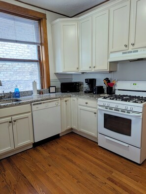 Microwave, oven, stovetop, dishwasher - Warm Modern 2BR • Walkable Roscoe Village (Chicago)