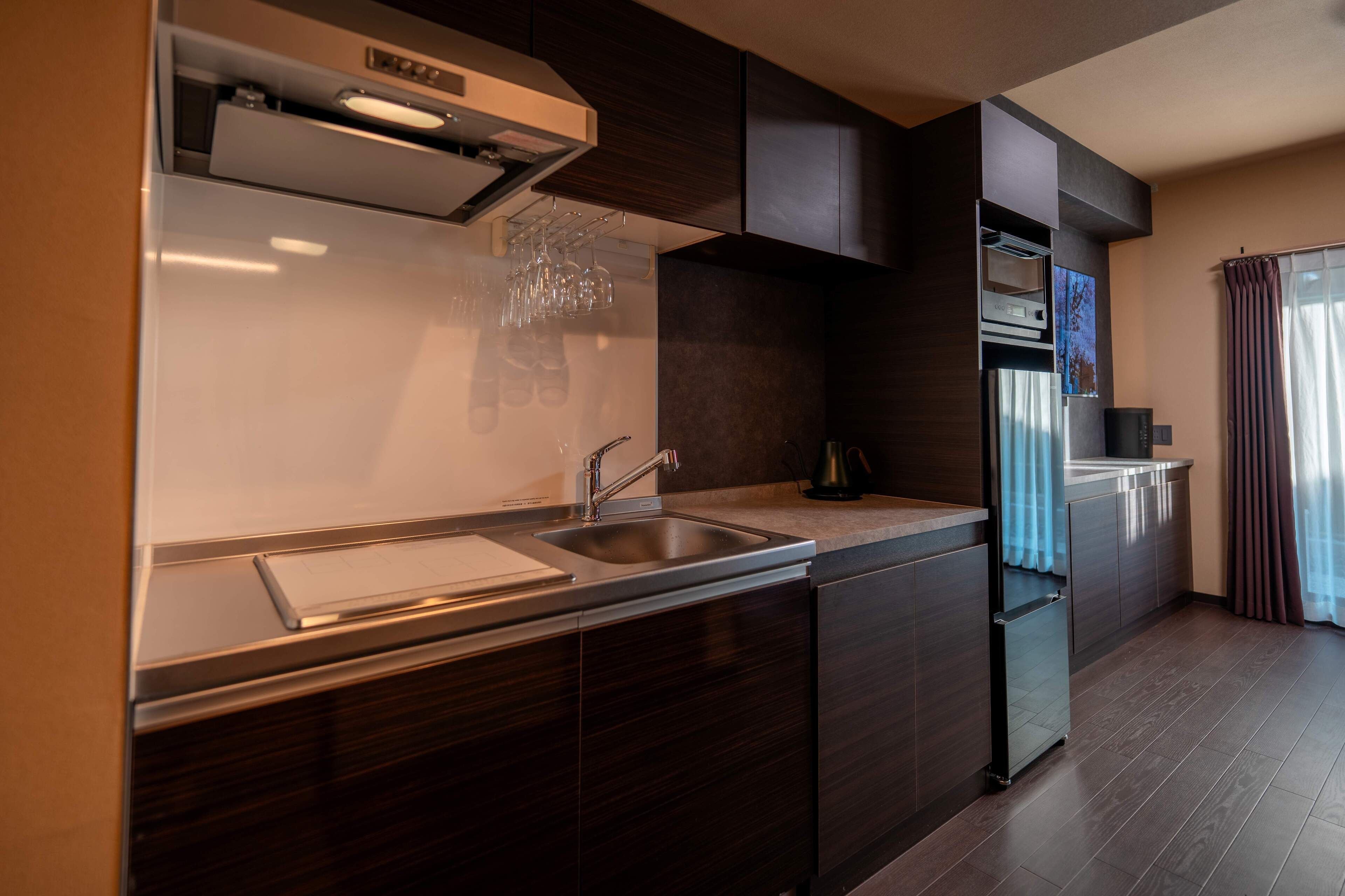 Full-sized fridge, microwave, stovetop, cookware/dishes/utensils