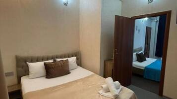 Standard Quadruple Room | Hypo-allergenic bedding, minibar, in-room safe, desk