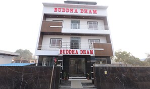 A multi-story building with the name "BUDDHA DHAM" prominently displayed on the facade. - BUDDHA DHAM (Vrindavan)