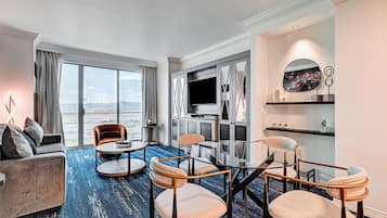 Family Suite, Balcony, City View | Living area | 42-inch flat-screen TV with satellite channels