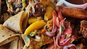 A tray of food including rice, meat, sausages, and tortillas. - Derby Place Lounge Karatina (Karatina)