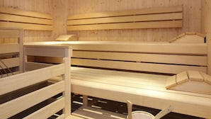 A sauna room with wooden benches and benches. - Alpinresort Kaprun top 2 by Interhome (Kaprun)