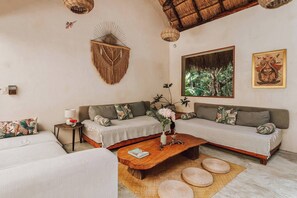 Shared Dormitory, 1 Bedroom, Garden View | Living room | Books - Room-casa Arkaana Jungle Ecocasita Share (Tulum)