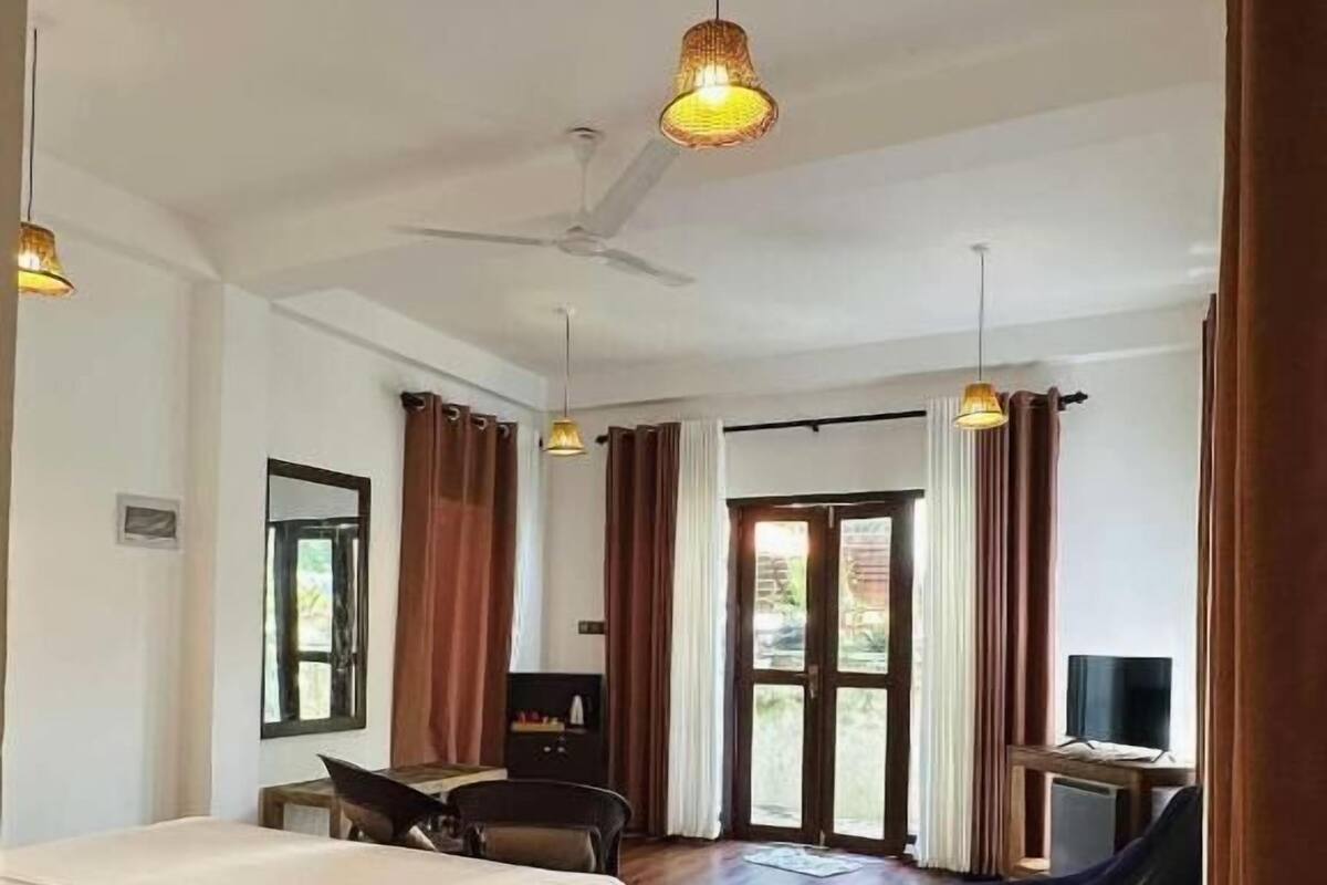 Deluxe Room, Patio, Garden View | Cribs (free), WiFi (free), bed sheets