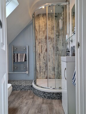 Shower, hair dryer, towels, soap