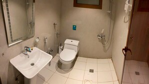A bathroom with a sink, toilet, and shower. - Amaken For Residential Units (Al-Hofuf)