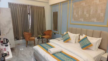 Deluxe Room, City View | In-room safe, desk, laptop workspace, blackout curtains