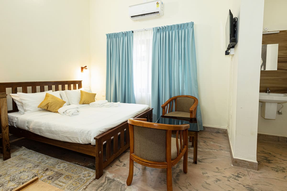 Standard Double Room, Garden View | In-room safe, desk, laptop workspace, iron/ironing board