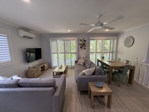Apartment | Living room - The Palms - Beach Retreat With Pool, Garden, BBQ (Toogoom)