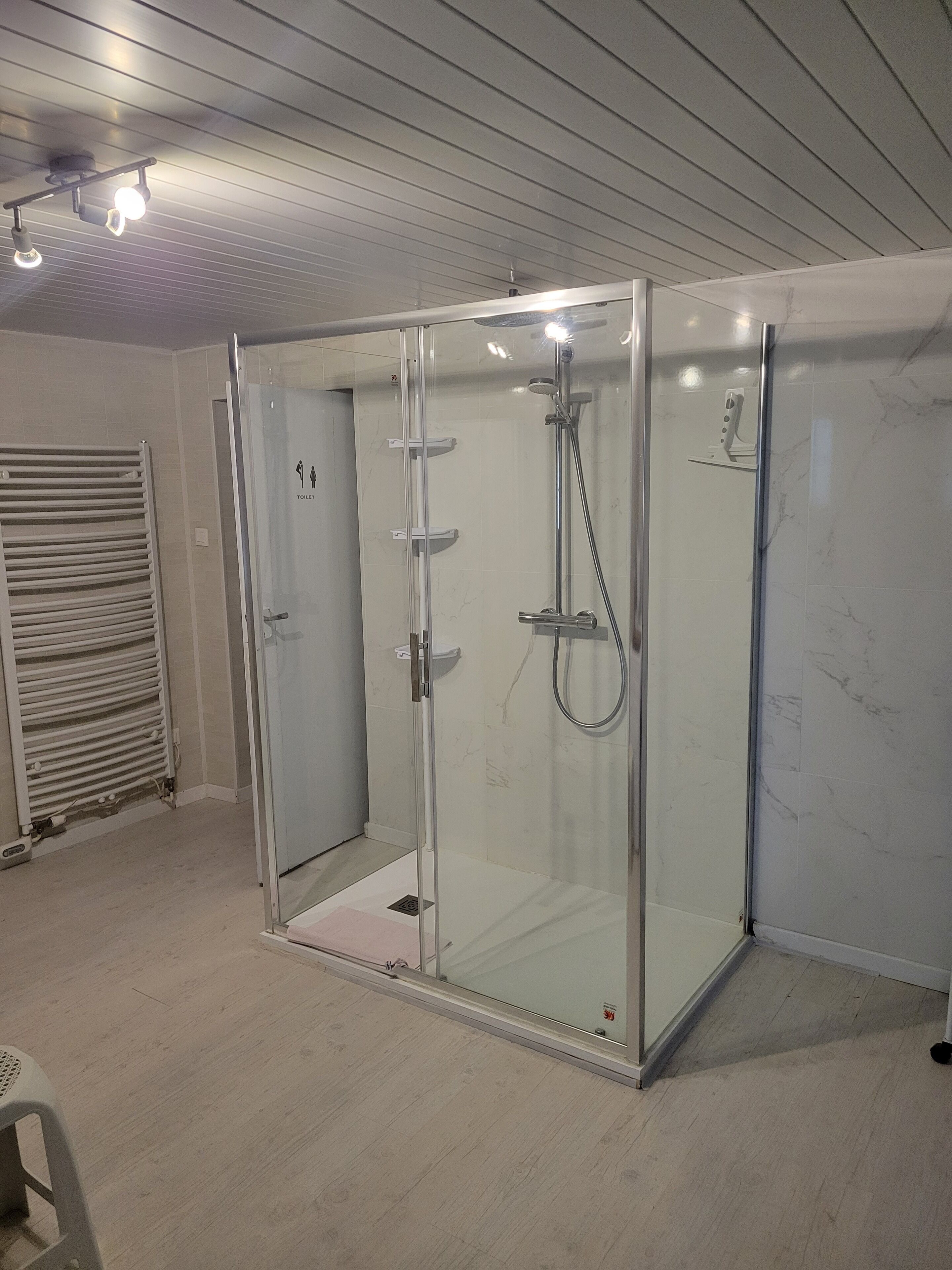 Shower, hair dryer, towels, toilet paper