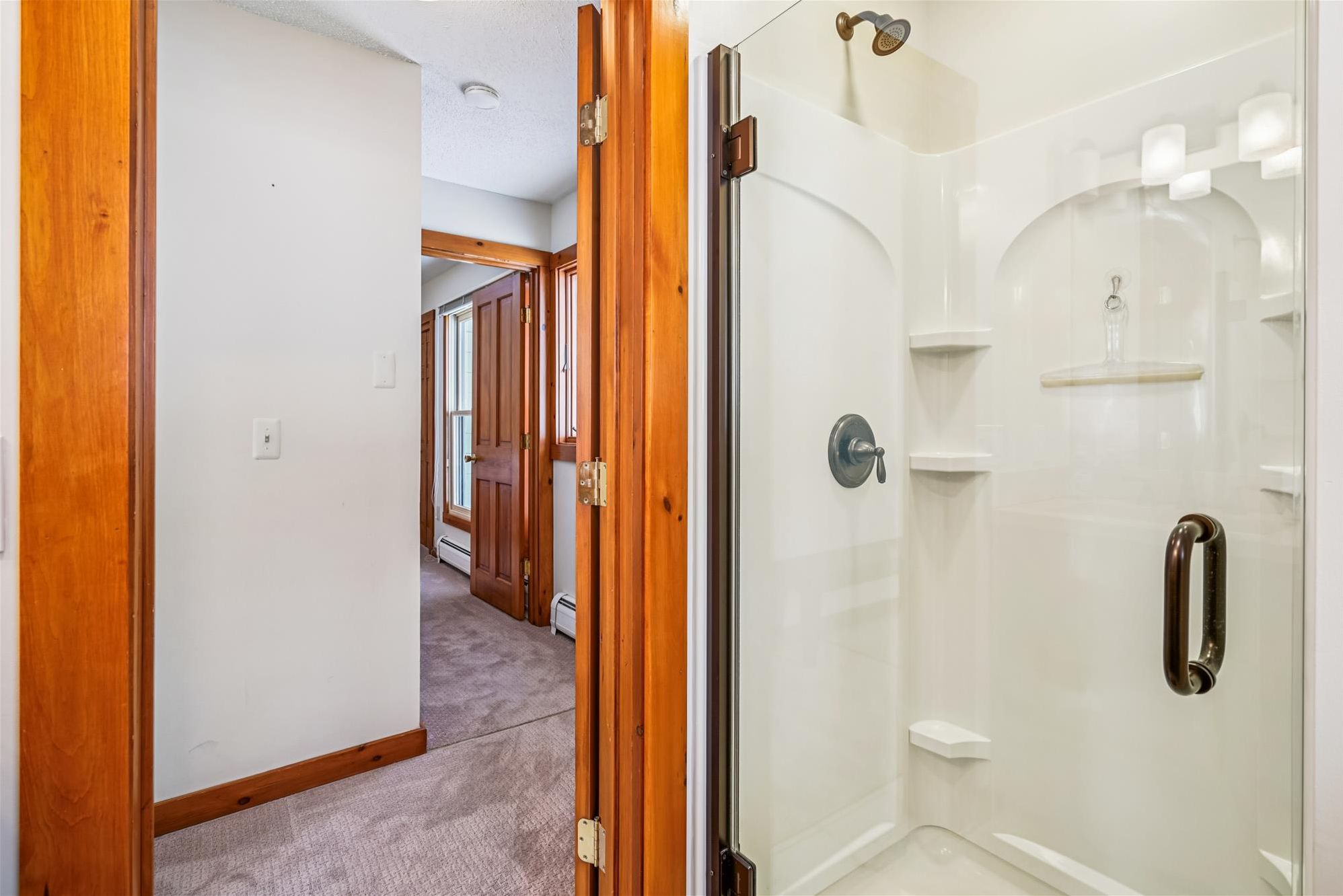 Shower with Glass Door - A walk-in shower with glass doors provides a clean, modern space to refresh after the day.