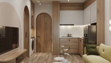 Elite Studio, Balcony | Living area | 40-inch flat-screen TV with digital channels