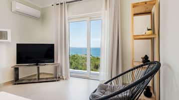 Apartment, 1 Bedroom, Balcony, Sea View | Living area | TV