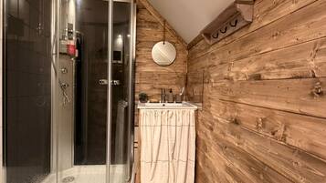 Shower, towels, soap, toilet paper