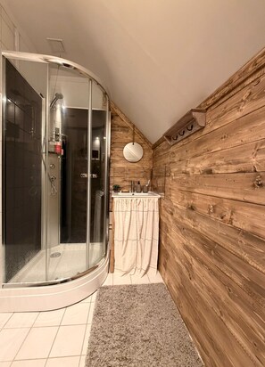 Shower, towels, soap, toilet paper