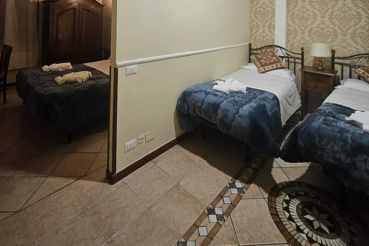 Deluxe Quadruple Room | Egyptian cotton sheets, premium bedding, down comforters