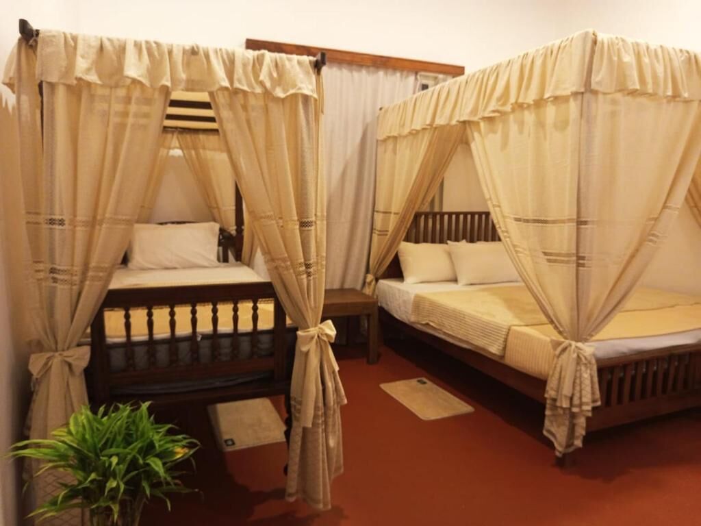 Comfort-Dreibettzimmer, Gartenblick | Bügeleisen/Bügelbrett