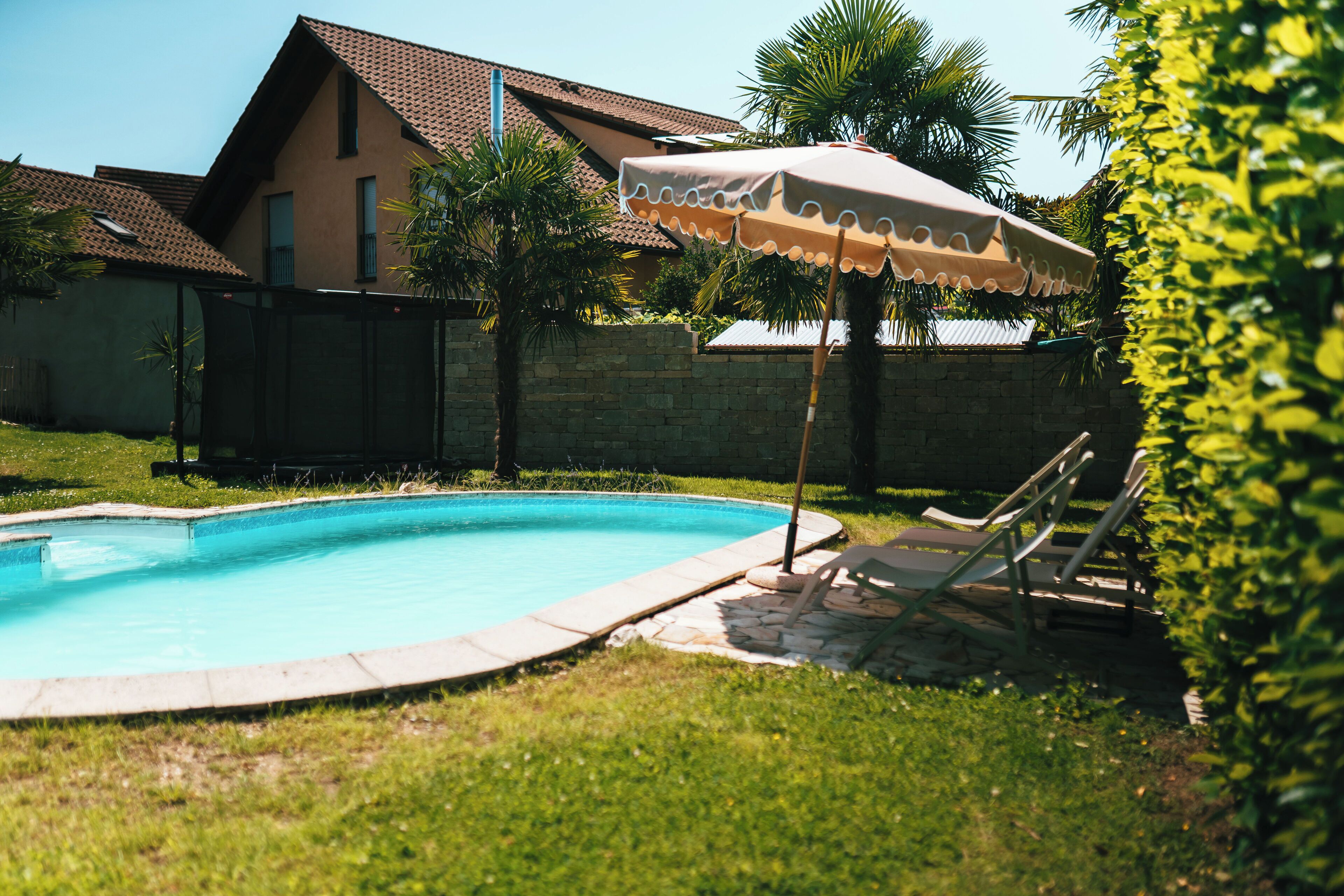 Seasonal outdoor pool, open 5:00 PM to 9:00 PM, pool umbrellas