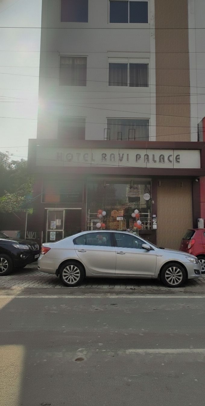 A building with a sign reading "HOTEL RAVI PALACE".