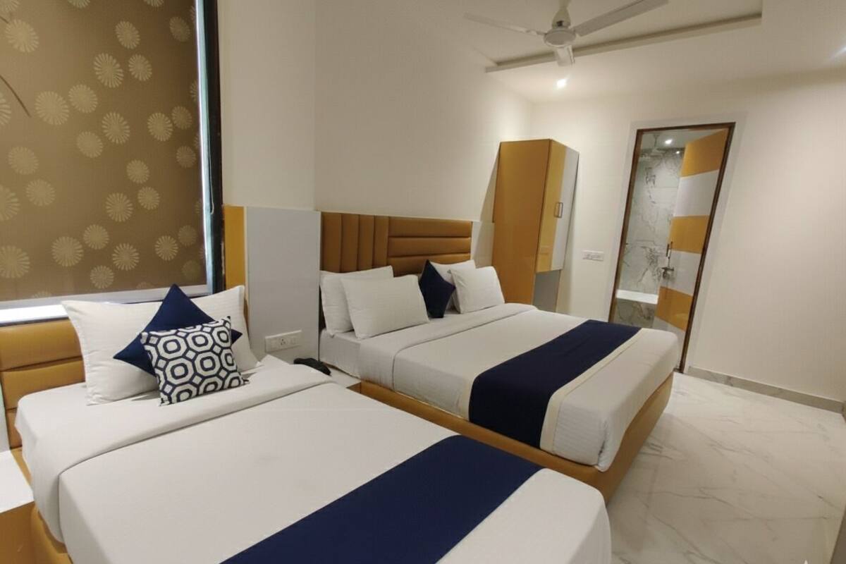 Family Triple Room, City View | In-room safe, desk, laptop workspace, blackout drapes