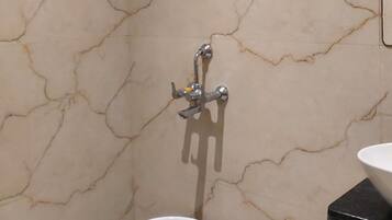 Family Quadruple Room, Garden View | Bathroom | Shower, slippers, towels, soap