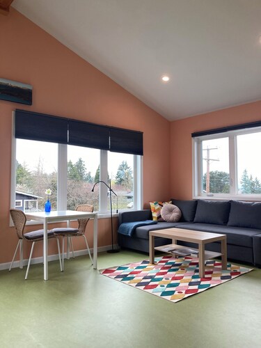 Colorful upstairs studio with lofted bed and soaking tub