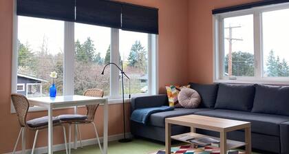 Colorful upstairs studio with lofted bed and soaking tub