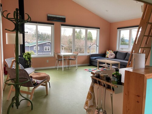 Colorful upstairs studio with lofted bed and soaking tub