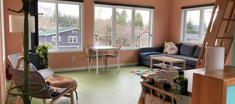 Colorful upstairs studio with lofted bed and soaking tub
