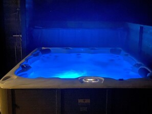 A hot tub with a blue light, surrounded by a dark interior. - "Alisa" - 1.9km from the sea by Interhome (Ålbæk)
