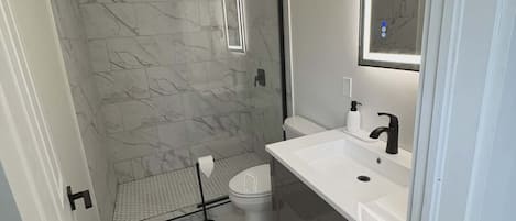 Shower, towels, soap, toilet paper