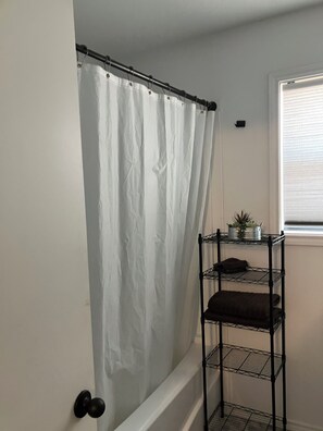 Shower, towels, soap, toilet paper