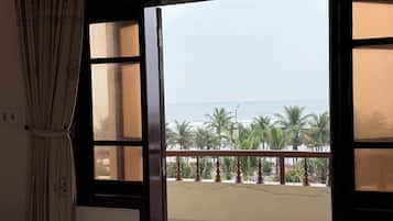 Superior Triple Room, Partial Ocean View | Laptop workspace, free WiFi