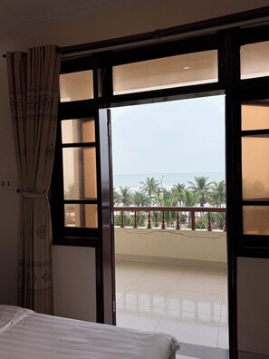 Superior Triple Room, Partial Ocean View | Laptop workspace, free WiFi