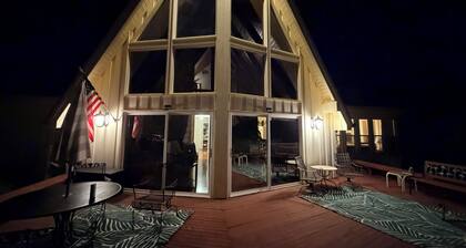 Well-Equipped Lakefront Home on a Large Lot with Dock Access and Sunset Views