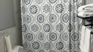 Shower, hair dryer, towels, soap